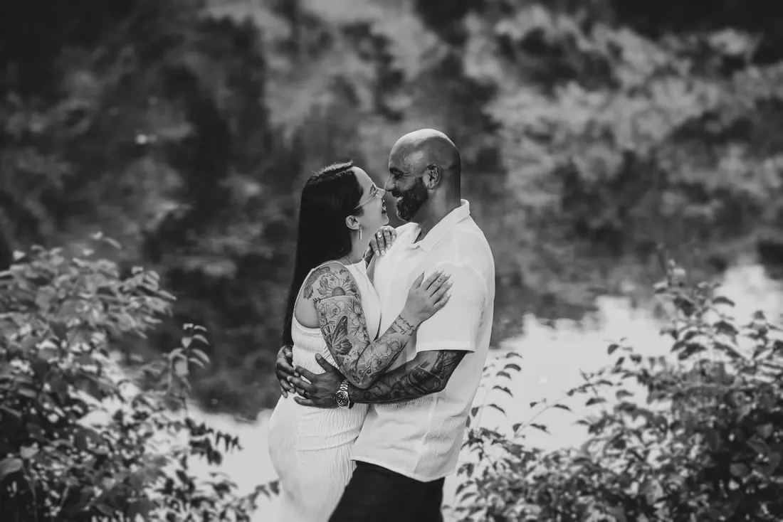 A couple embracing in the woods, black and white