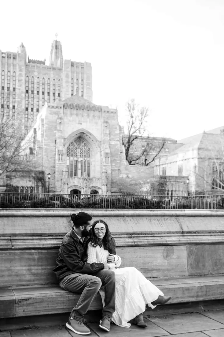 A couple beside gothic architecture, black and white