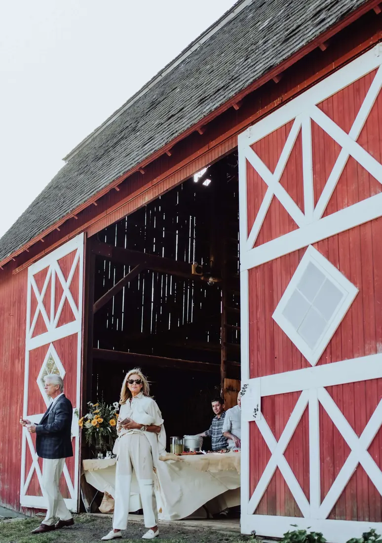 A red barn set for an outdoor party
