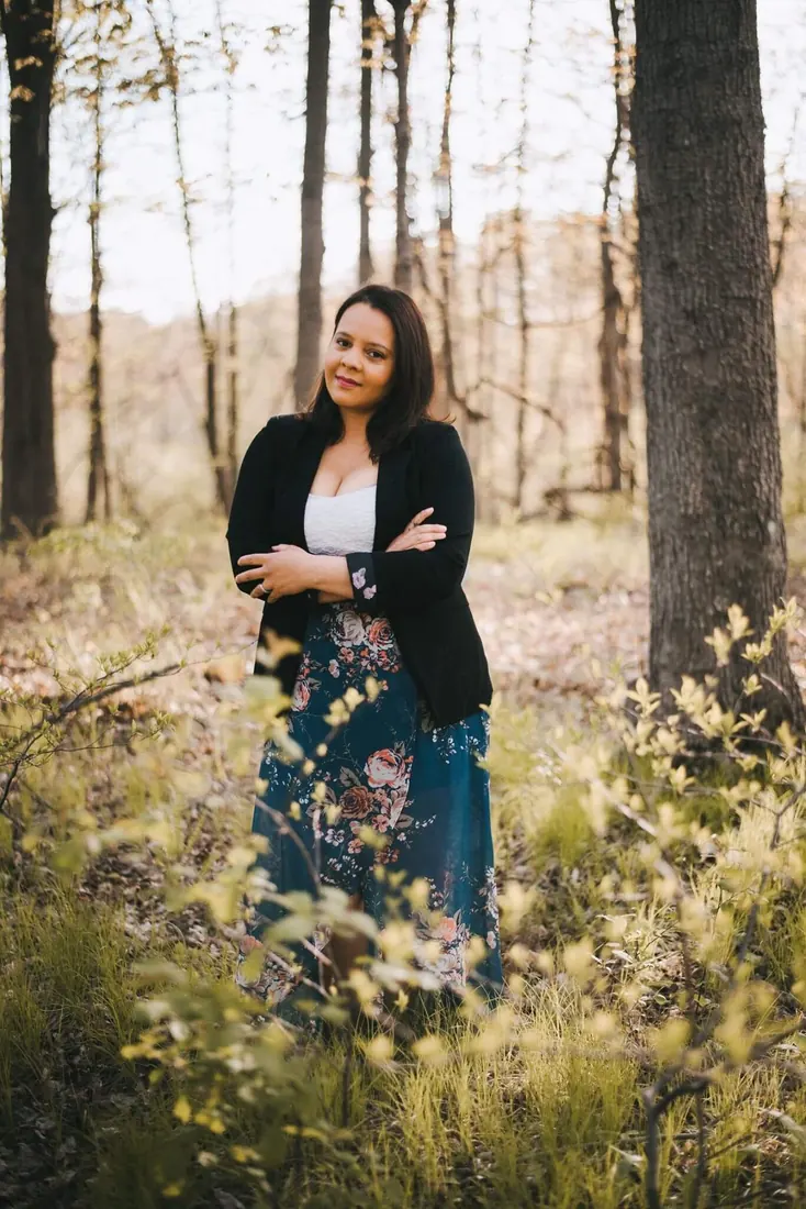 Vanessa Peterson standing in a Connecticut woodland