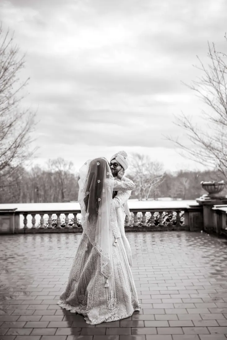 A bride alone on a terrace, black and white